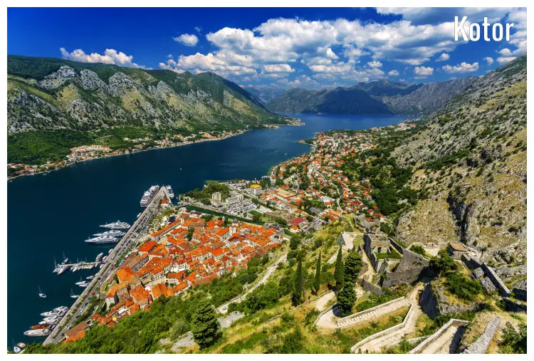 The walled city of Kotor in Montenegro, in the Bay of Kotor, surrounded by mountains on all sides The walled city of Kotor in Montenegro, in the Bay of Kotor, surrounded by mountains on all sides